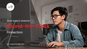 A young professional monitors a website on a desktop computer, representing website monitoring for small businesses.