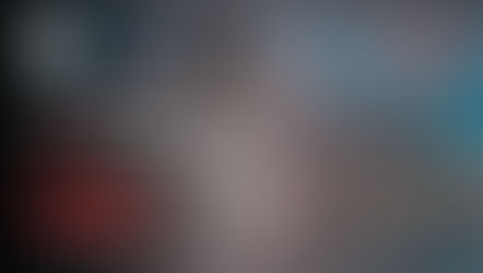 Team assembling large "BRAND" letters at sunrise, symbolizing how reliable sites reduce website downtime for small business and drive success.