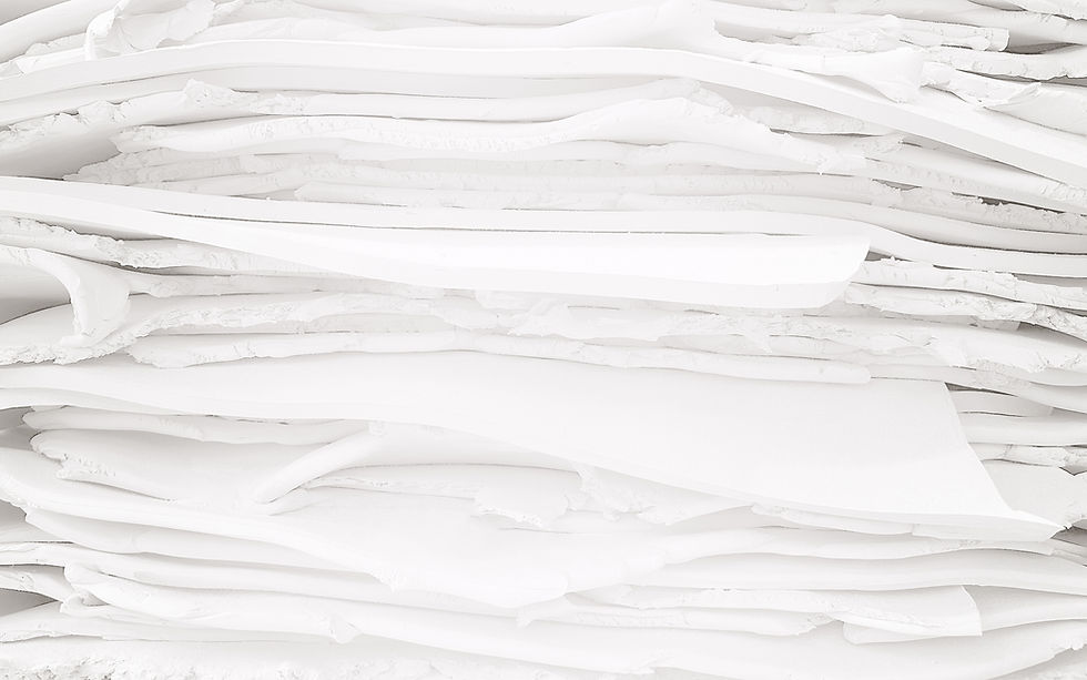 Layered sheet of white vulcanised rubber material