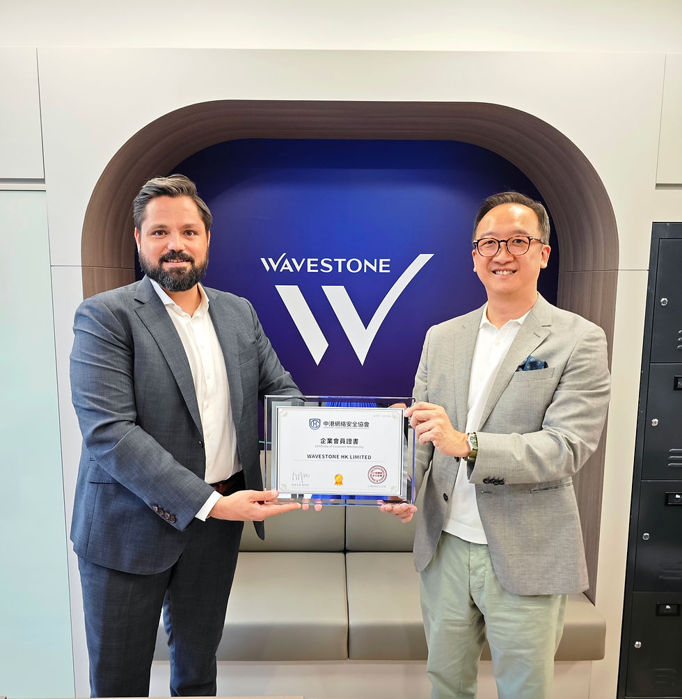 Mr. David Ip, Founding Chairman of HKCNSA (right), presented a corporate membership certificate to Mr. Axel Chagnoleau, Senior Manager - Head of APAC Cybersecurity & Operational Resilience of Wavestone (left).