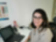 Dr Amilia Alifrangis, Private GP at All Health Matters Canterbury clinic, smiles at the camera from the doctor's room.