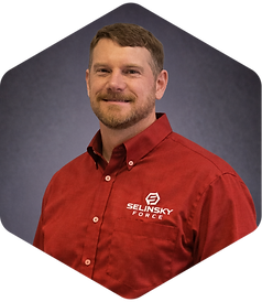 Team member smiling in red SELENSKY POWER shirt