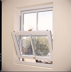White uPVC Vertical sliding sash window with a single tilt inwards bottom sash