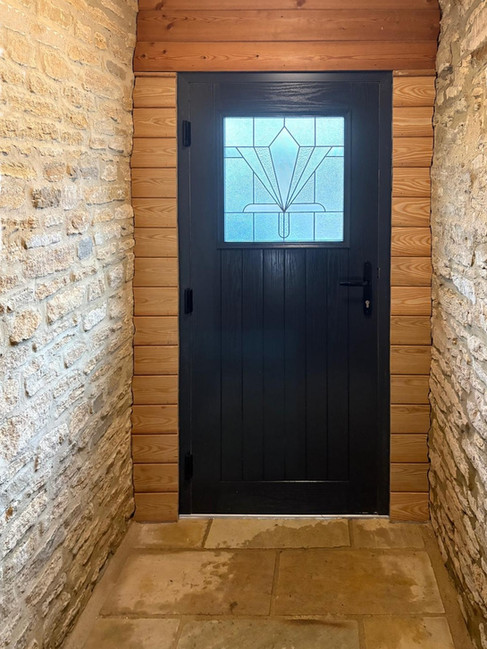 Interior view of new Rehau composite door with tongue and groove cladding in Oxfordshire home