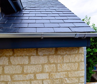 Equinox Anthracite Grey solid roof with metalic guttering.jpg