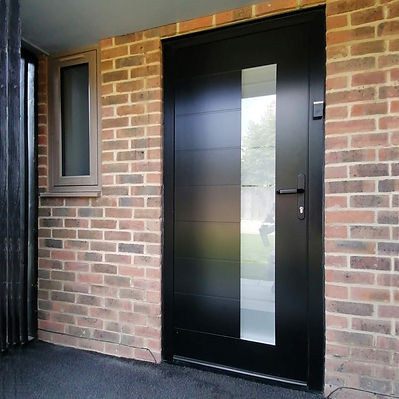 Black Spitfire aluminium entrance door with a glazed panel and a side window