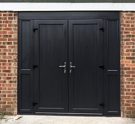 Black upvc double doors with matching side panels, chrome handles and black hinges as Garage Doors