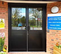 black aluminium commercial entrance doors in the South OXON adult mental health hospital.jpg