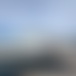 Scorpion Bay Marina at Lake Pleasant, featuring a restaurant and general store building on the water, with visitors walking along the dock under a sunny, clear sky.