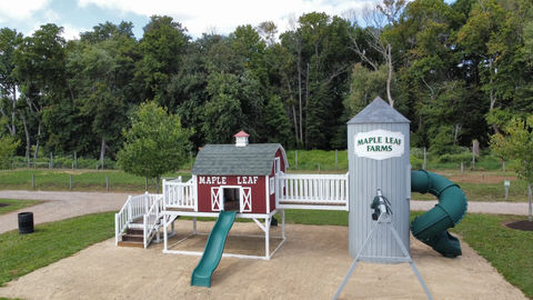 Farm-themed playground with a silo structure.