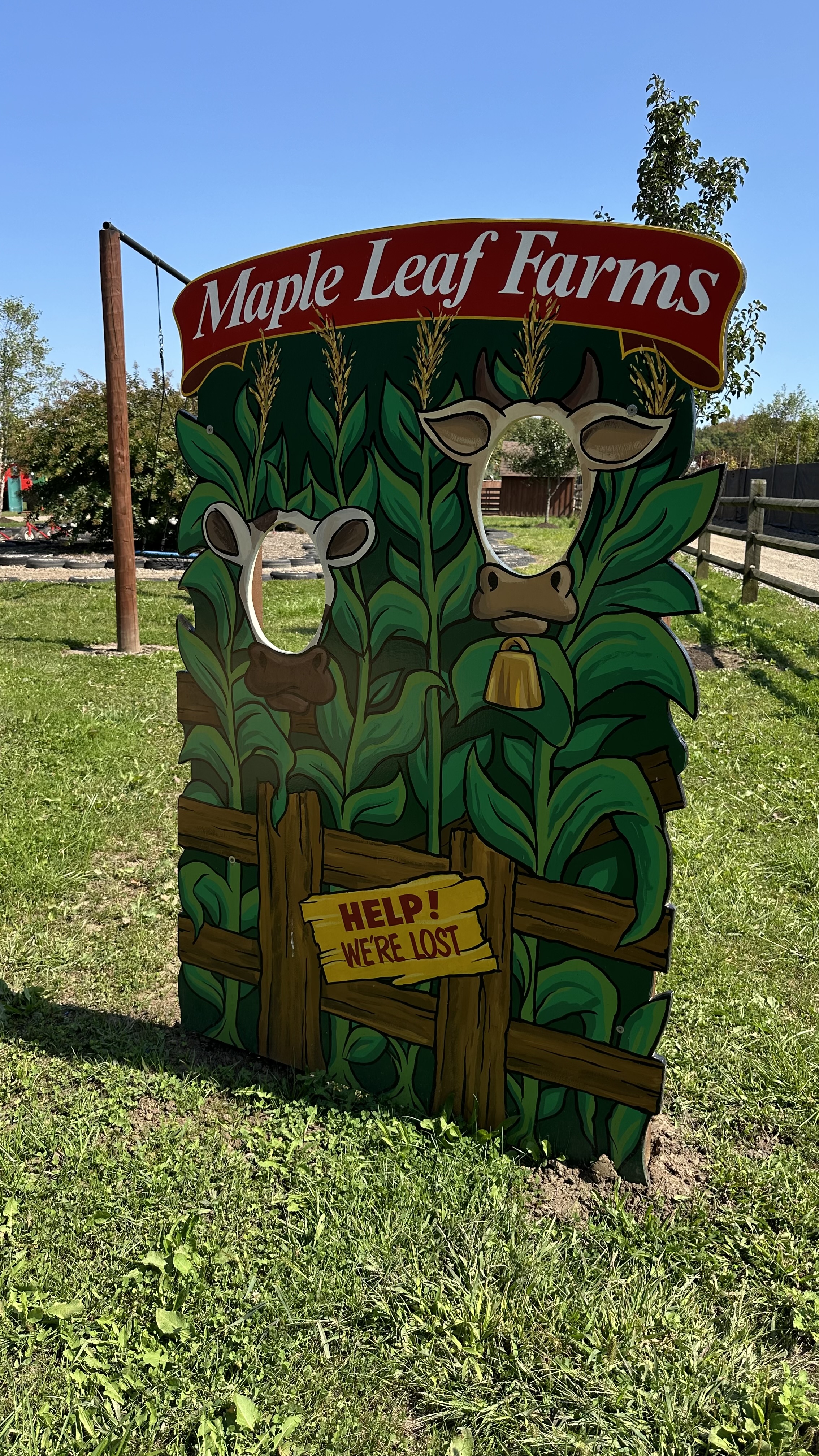 Visitors by the corn maze sign at Fall Fun Fest