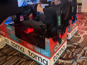 Mobile Racing Simulator with branding at convention.