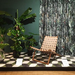 Relaxing chair with plants and curtains