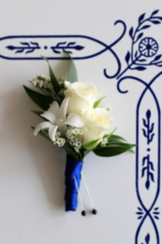 White boutonniere with stem wrap