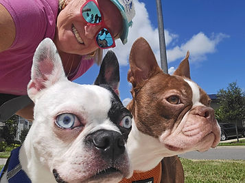 Dianne-a-Nona-Paws-Pet-Sitter-is-walking-two-dogs-in-Lake-Nona