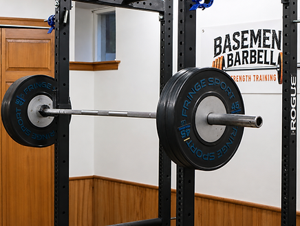 Barbell squat rack used for one-on-one strength coaching