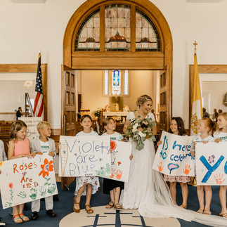elementary students surprising bride on wedding day