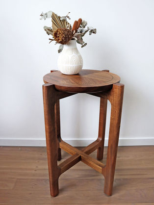 Side table with a vase of flowers