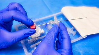 Needle for epidural anesthesia. Tuohy needle in doctor's hands. Soft filter on the image.j