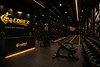 Corex gym interior with weights and branding.