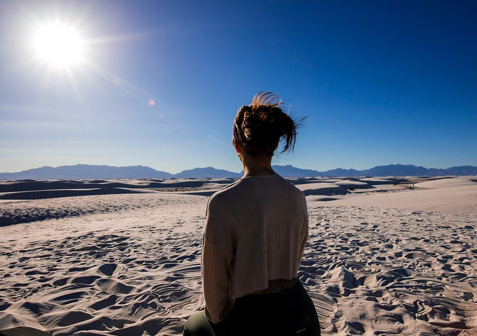 Self care is health care: take your well-being into your own hands. Woman meditating at white sands national park