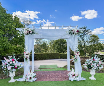 Onsite Pergola Decor with our Rose Garden Garlands, Draping and Large Urns