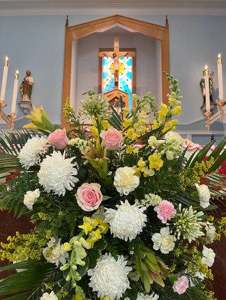 A flower arrangement on an altar