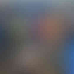 A group of people gathered around an outdoor fire