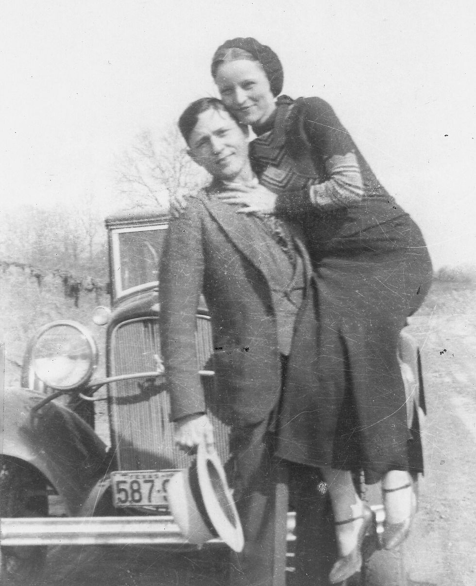 Bonnie and Clyde in a photo from 1932-1933, found undeveloped in an abandoned hideout - public domain courtesy of Wikipedia/Library of Congress