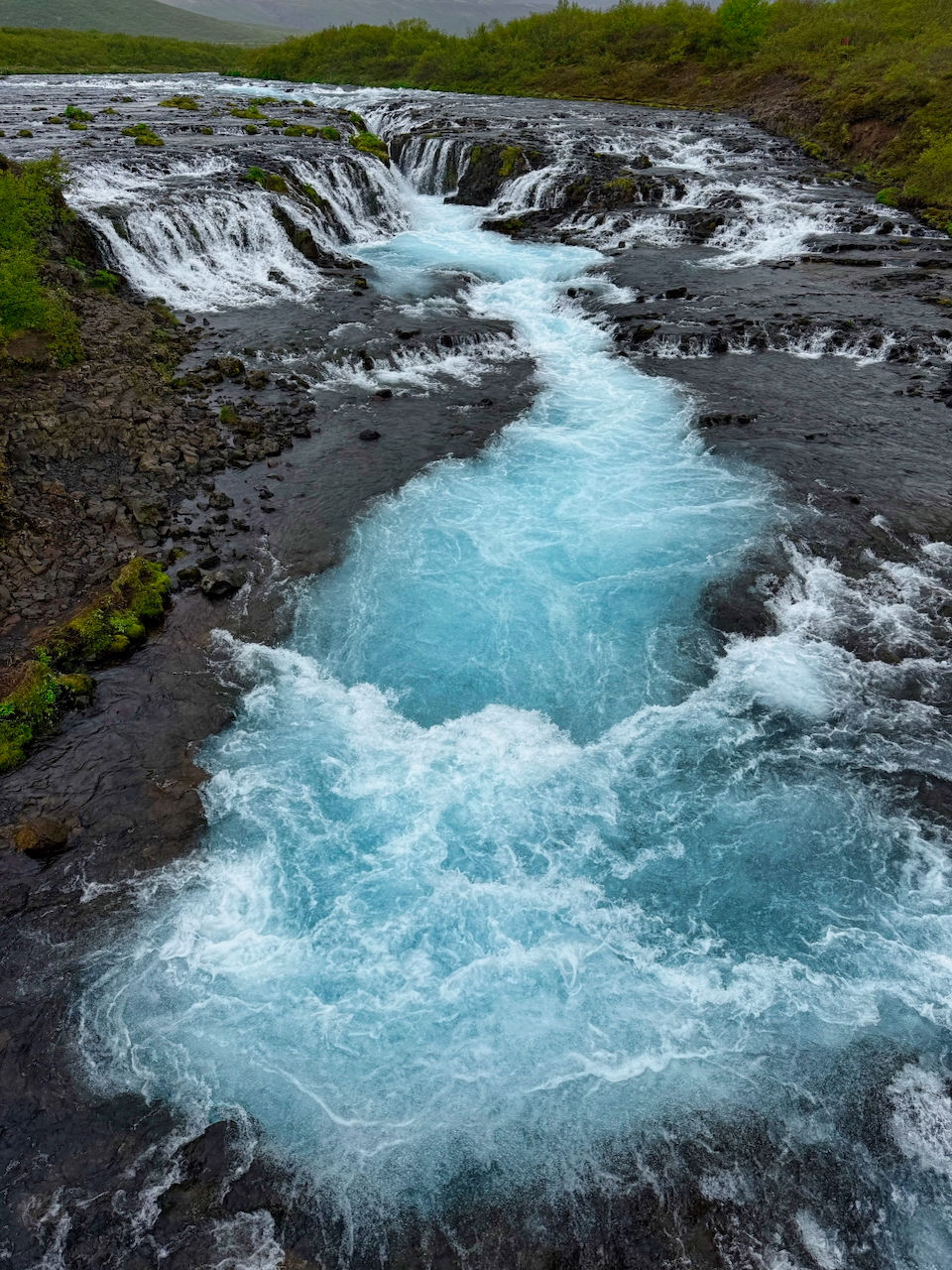 Bruarfoss' beautiful blue hue is caused by glacial powder in the water.
