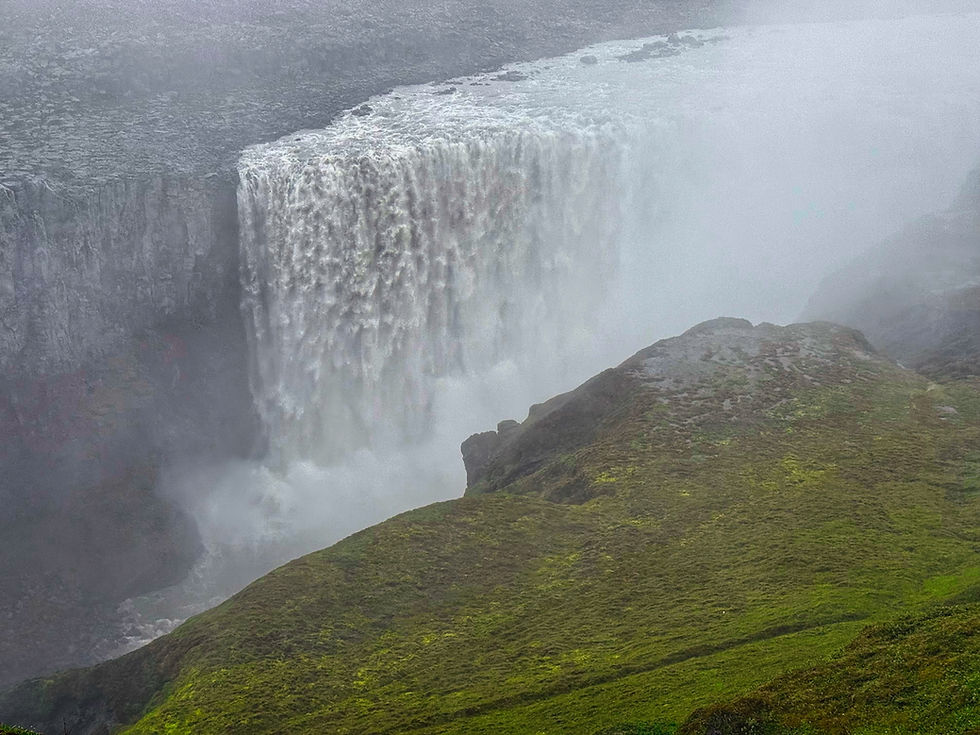 Dettifoss, in the northeast, is the largest waterfall in Europe. Unfortunately, its powerful mist was blowing right toward us as we looked down, obscuring our view.