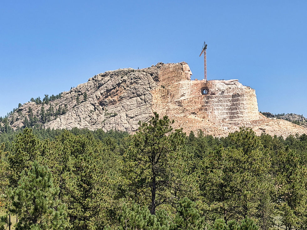 All four of the Mount Rushmore sculptures would fit in that space behind Crazy Horse's head!