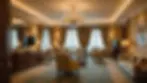 Wide angle view of an elegantly decorated luxury hotel suite