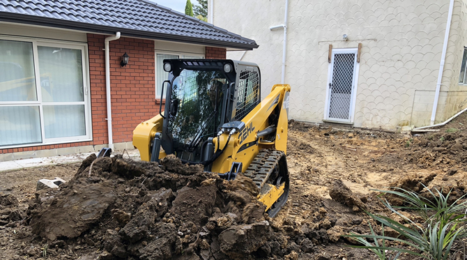 Gehl loader in back yard