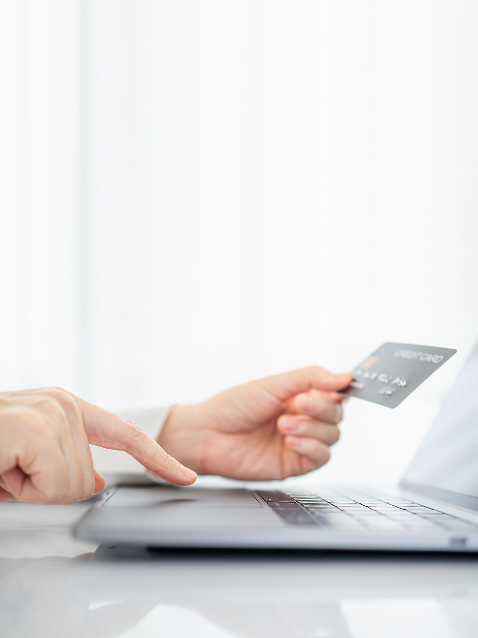 hands-holding-credit-card-using-laptop-online-shopping