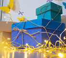cardboard boxes with yellow and blue yarn and yellow and blue paper butterflies and fairy