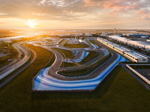 Aerial view of a Formula 1 racing circuit, illustrating the commercial opportunities that extend beyond major sporting venues.