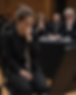professional musician performing in audition with visible tension and focus