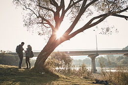 Hikers by the Bridge at Sunset