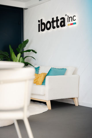 custom branded wall with 3D logo for ibotta at corporate event