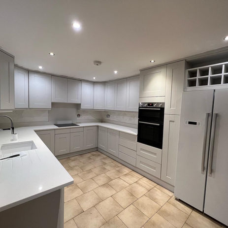 Wide shot of a kitchen sprayed in white - Work was completed in Hadleigh - Essex.