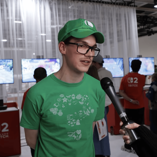Fan dressed as Luigi, Nintendo Switch 2 Experience Berlin - Mario Kart World