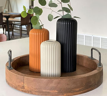 Black, white, and orange vases