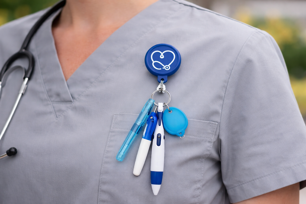 Close-up of a colorful nurse badge reel clipped to a scrub pocket