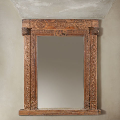 carved wooden wall mirror