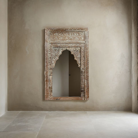 carved wooden arch mirror