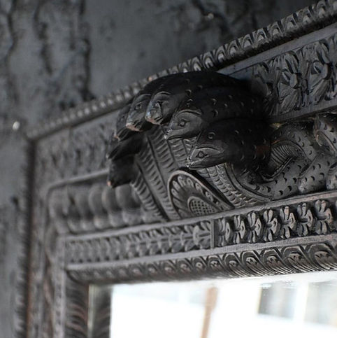 wooden wall mirror close up