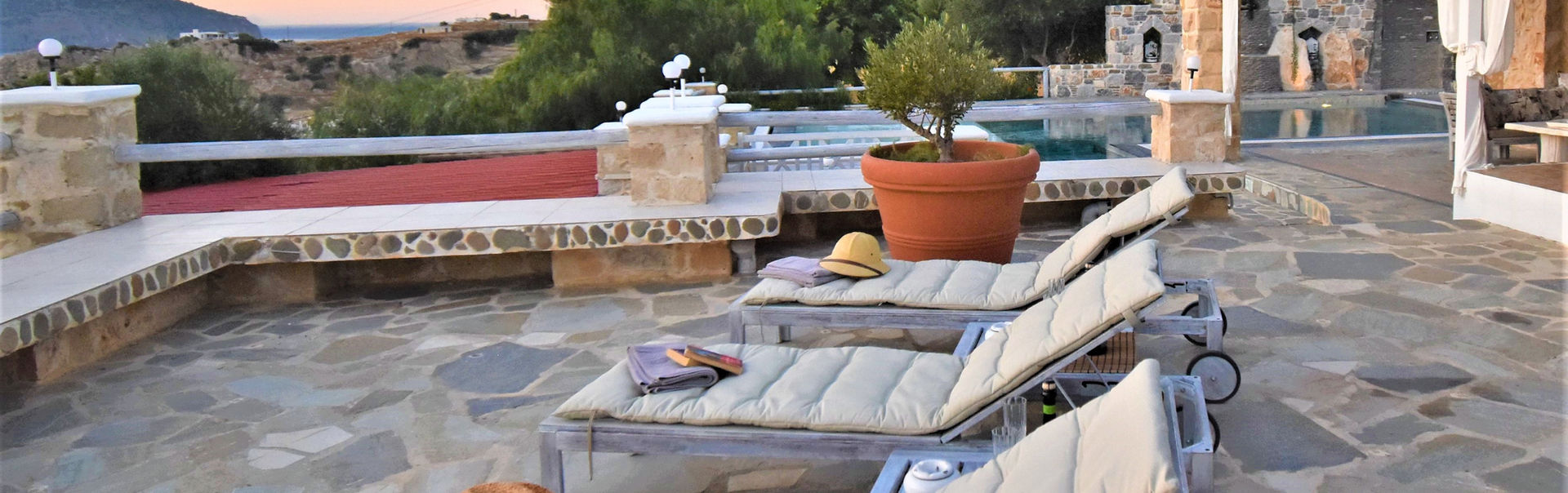 Outdoors, sunlight on the terraces, and withdraw on a hammoc. Villa Michel-Angelo, vacational rentals, Karpathos, Greek Islands.