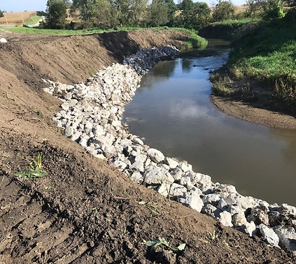 Streambank stabilization project completed in Rock Island County with riprap.