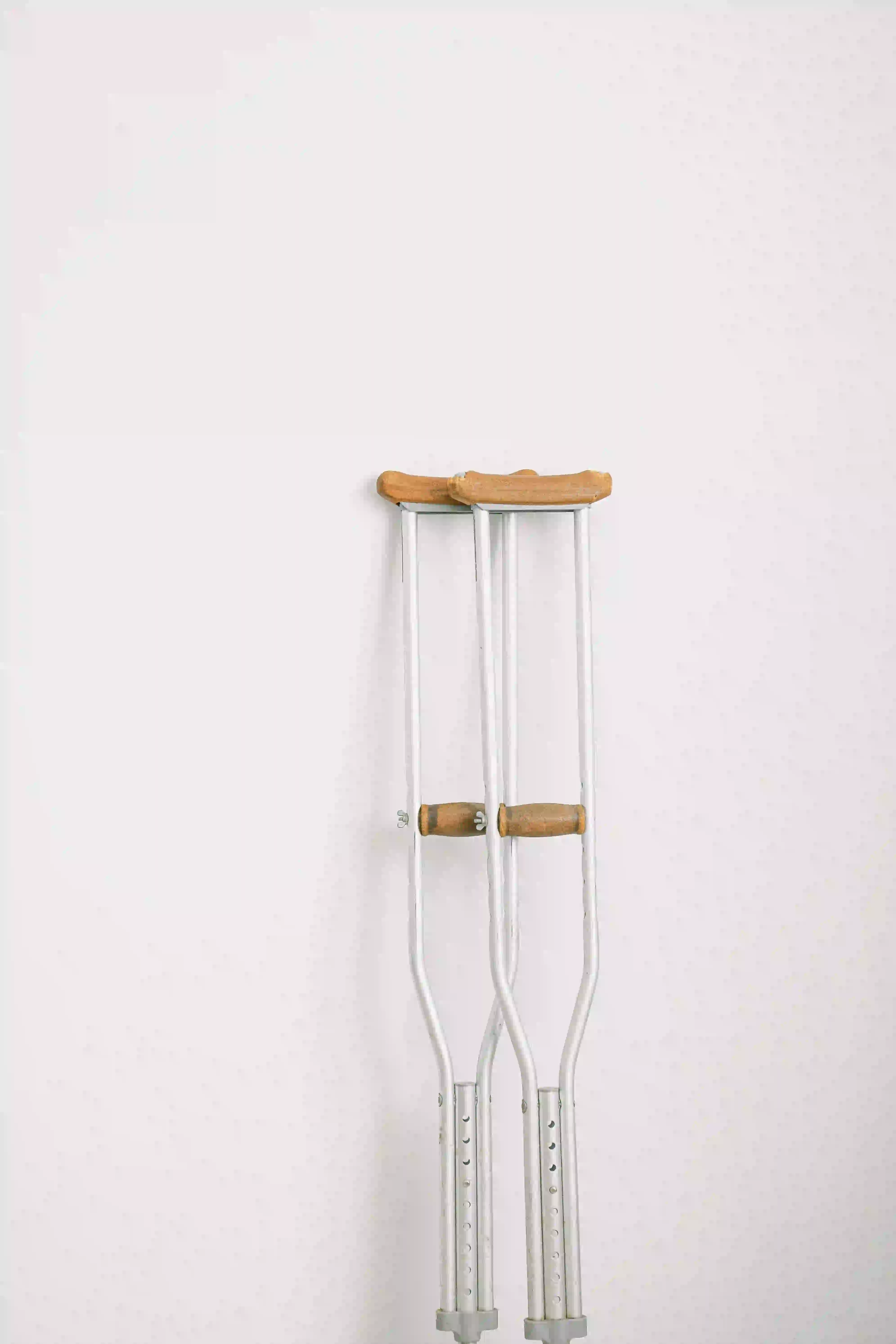 crutches against a wall for a post surgical patient being treated at Kinoveo Physiotherapy in Kanata